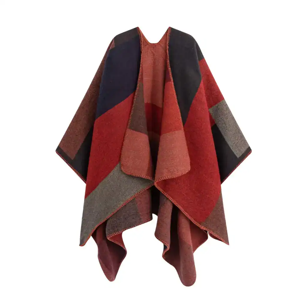 Poncho châle à motif géométrique rouge et noir, style plaid, sans capuche, avec bordure brodée.