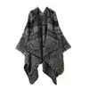 Poncho châle à motif paisley gris et noir, coupe ample avec capuche intégrée.