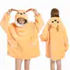 Poncho plaid enfant orange avec capuche et oreilles de lapin.