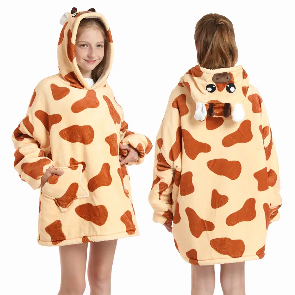 Poncho plaid enfant vache, motif taches marron, capuche avec oreilles et museau.