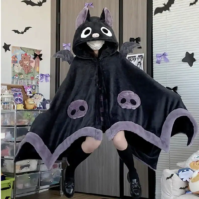 Poncho plaid Halloween chat noir avec capuche et détails squelettes.