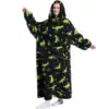 Poncho polaire femme nuit avec motif dinosaures verts sur fond noir.